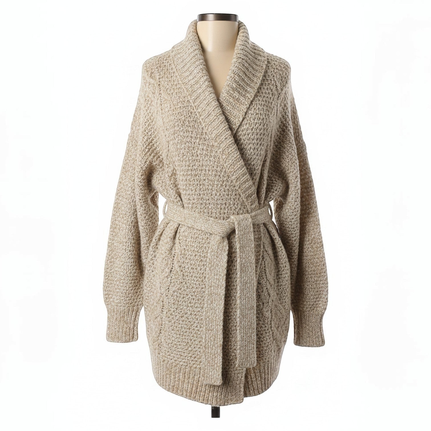 Oversized beige chunky knit wrap cardigan with shawl collar and matching belt tie. Cable knit details on sleeves and front panels.