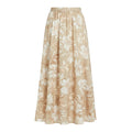 Flowing beige maxi skirt with an all-over white and tan floral print and an elastic waistband.
