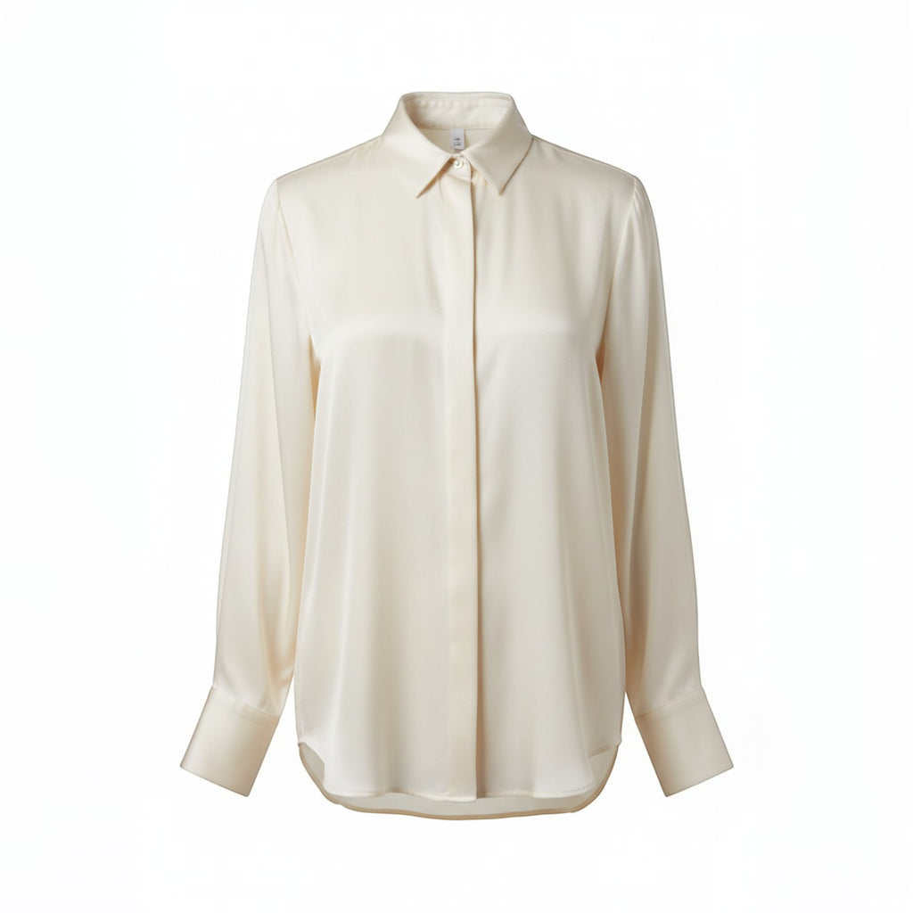 Cream silk-feel button-front blouse with a classic collar and long sleeves, featuring a fluid drape and a subtle sheen.
